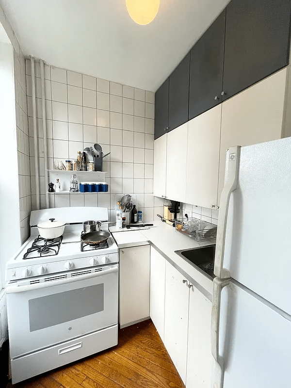 kitchen with white cabinets and appliances