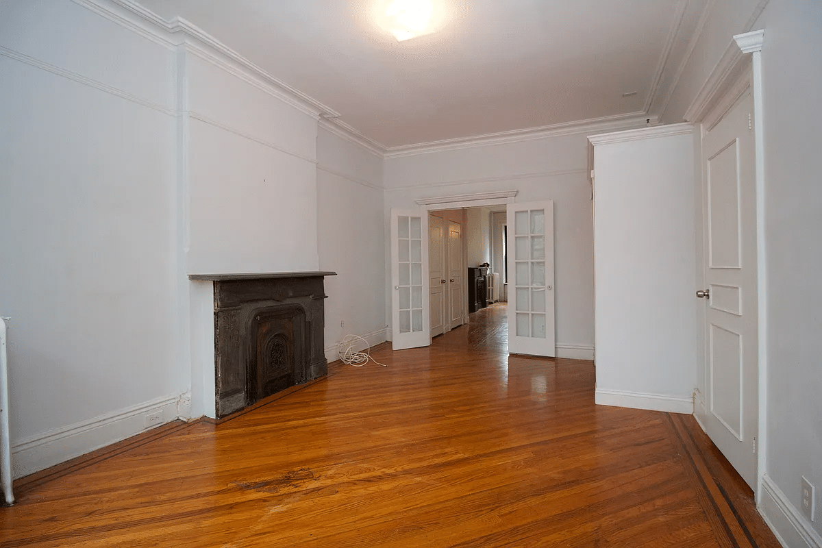 bed stuy - living room with mantel, french doors, picture rails