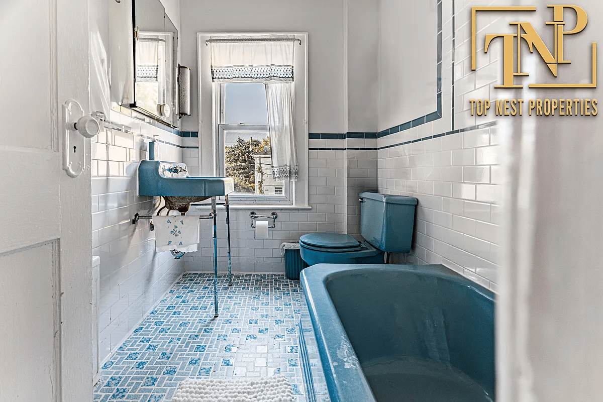 bathroom with blue fixtures, blue and white tile