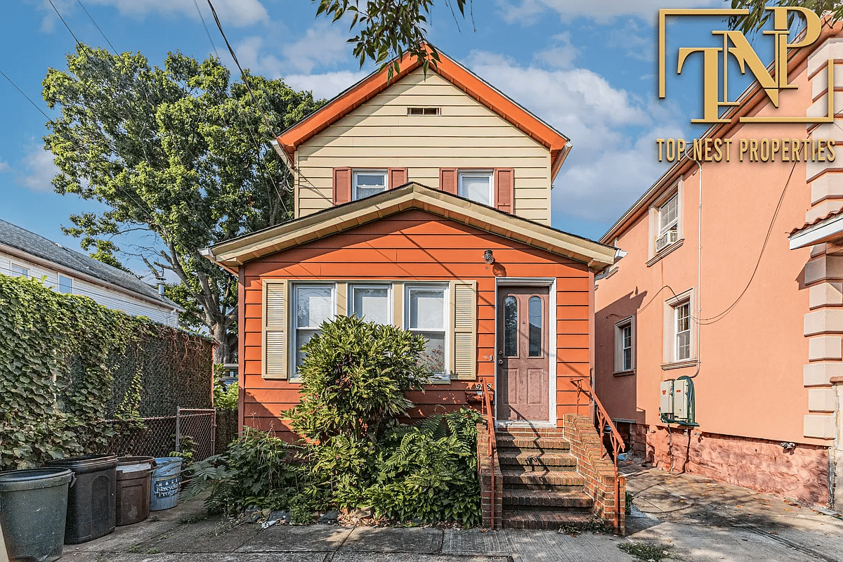 orange and yellow exterior with enclosed front porch