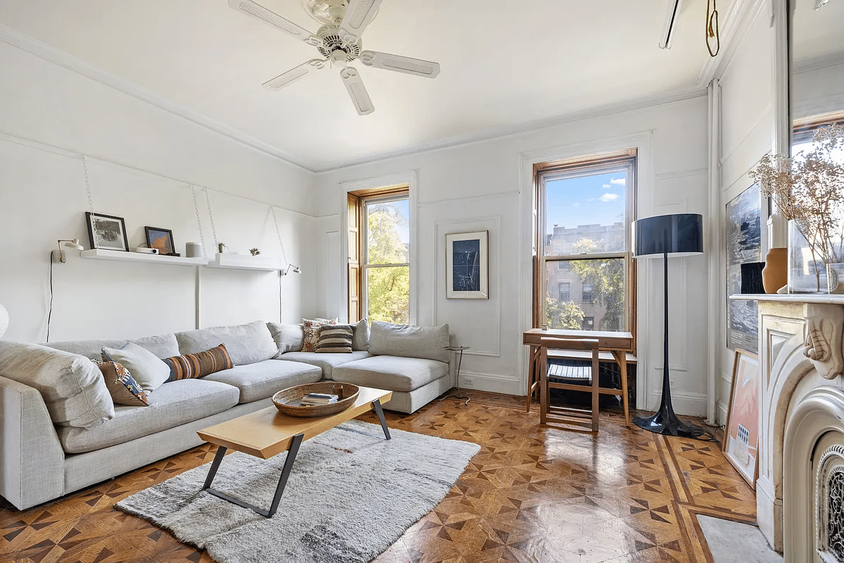 carroll gardens - living room with wood floor, marble mantel