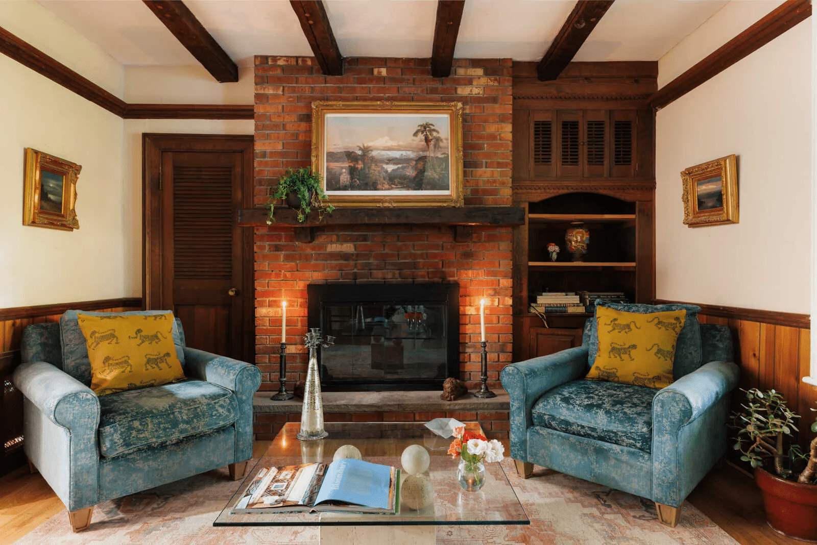 den with brick fireplace wall