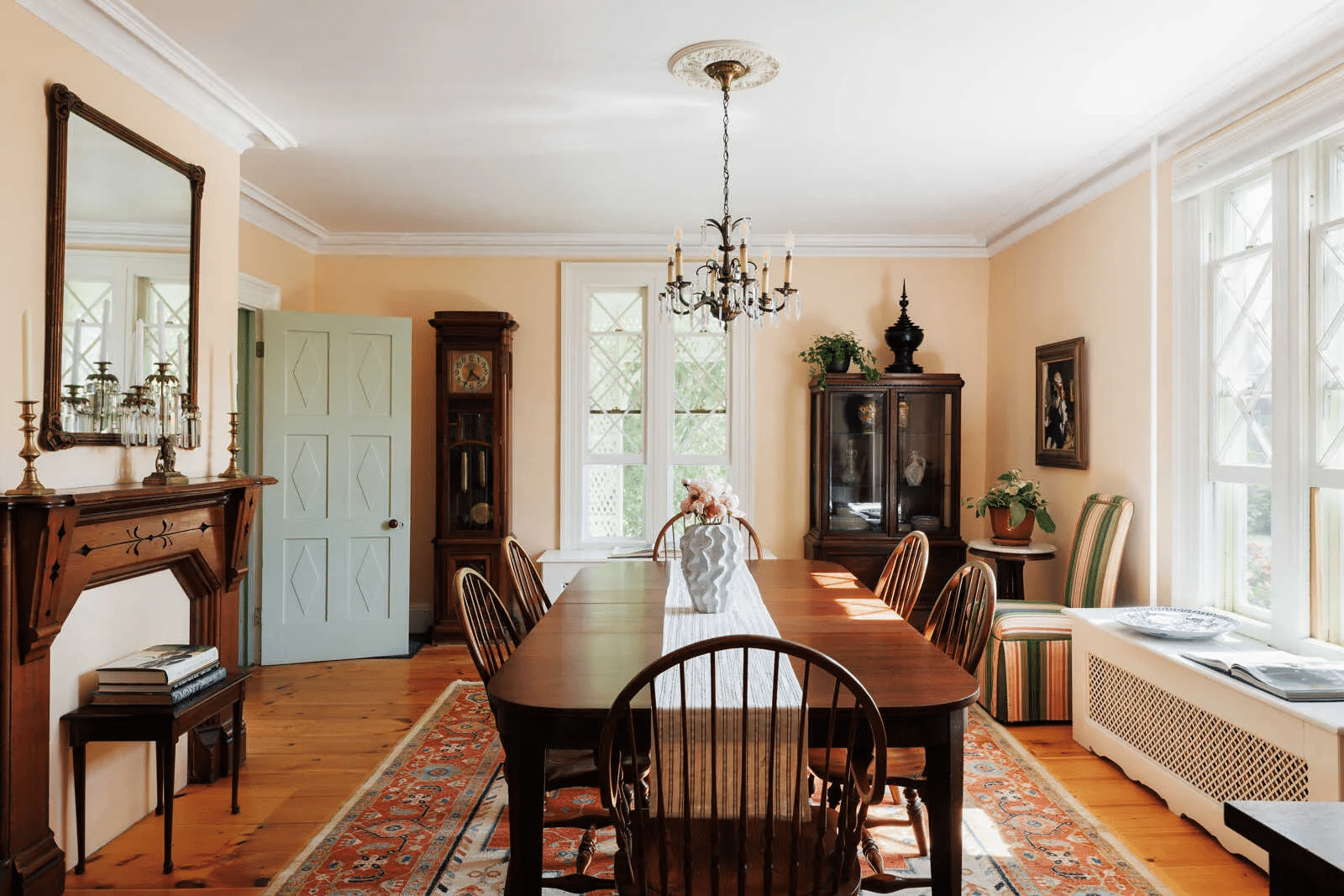 dining room with wood floor, decorative mantel