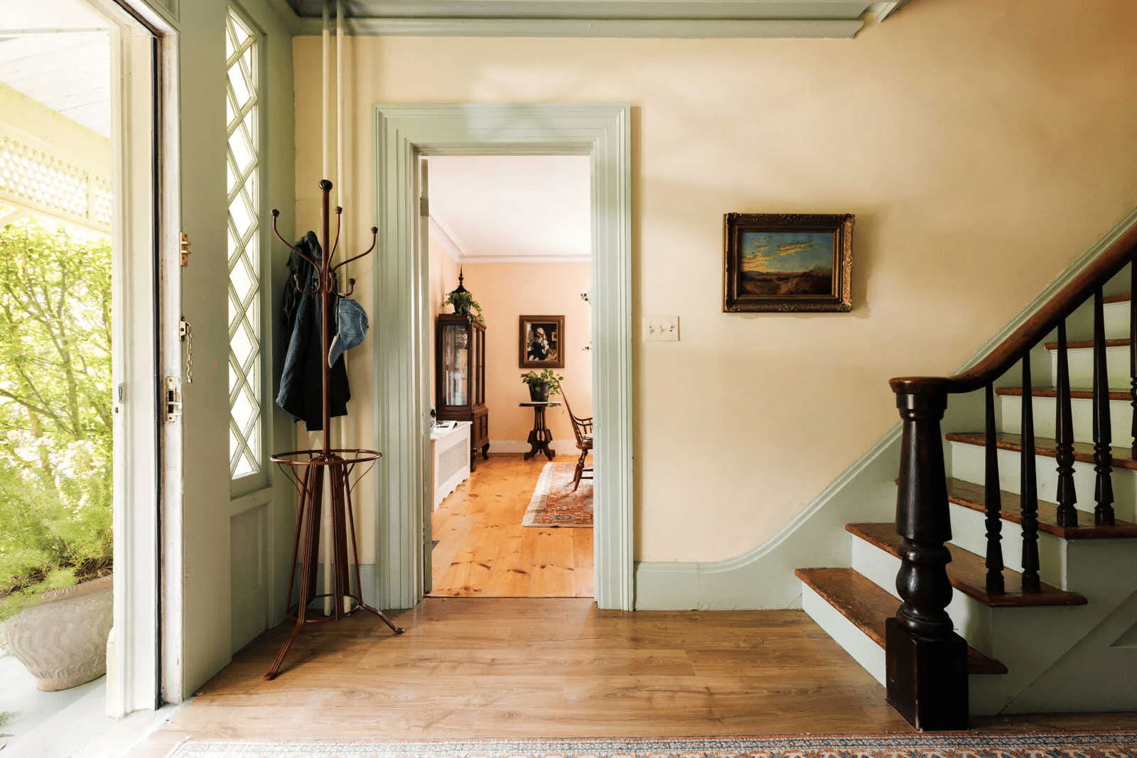 entry with original stair, wood floors