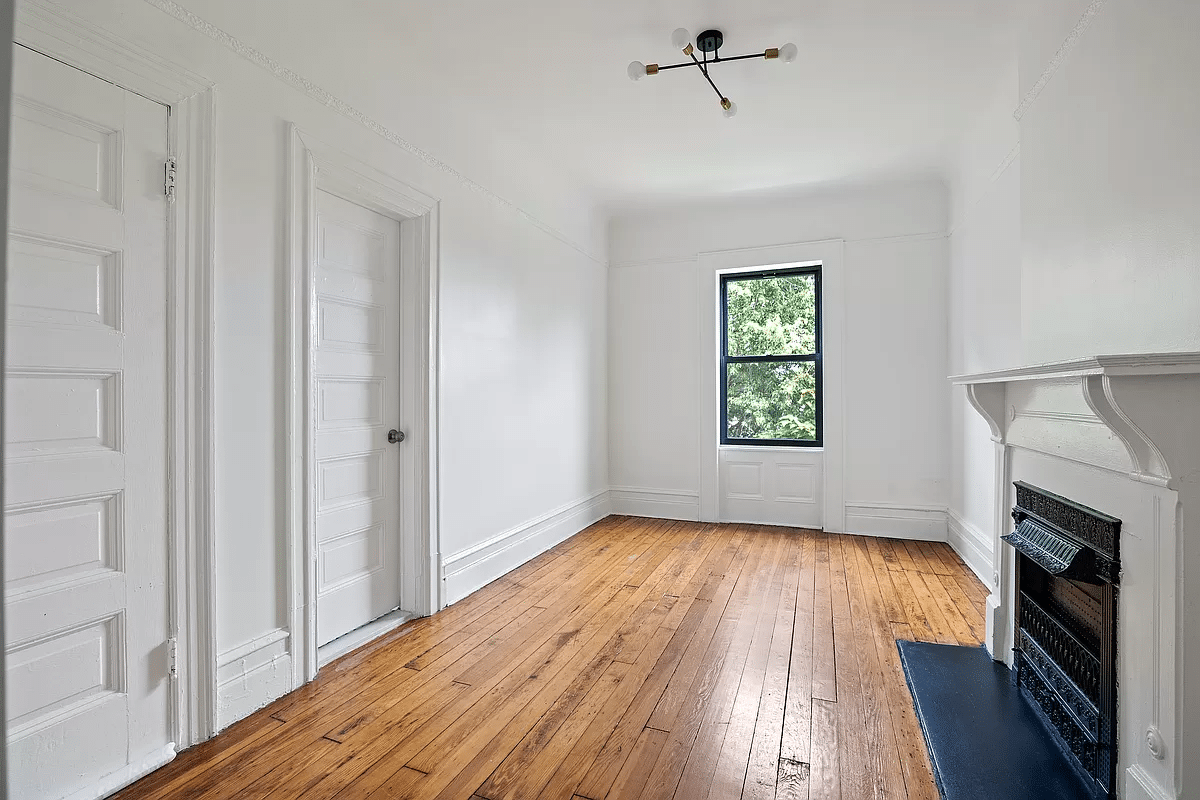 bedroom with one window, mantel