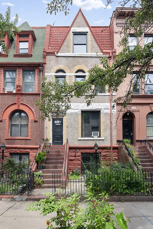 brick row house exterior with red tiled roof