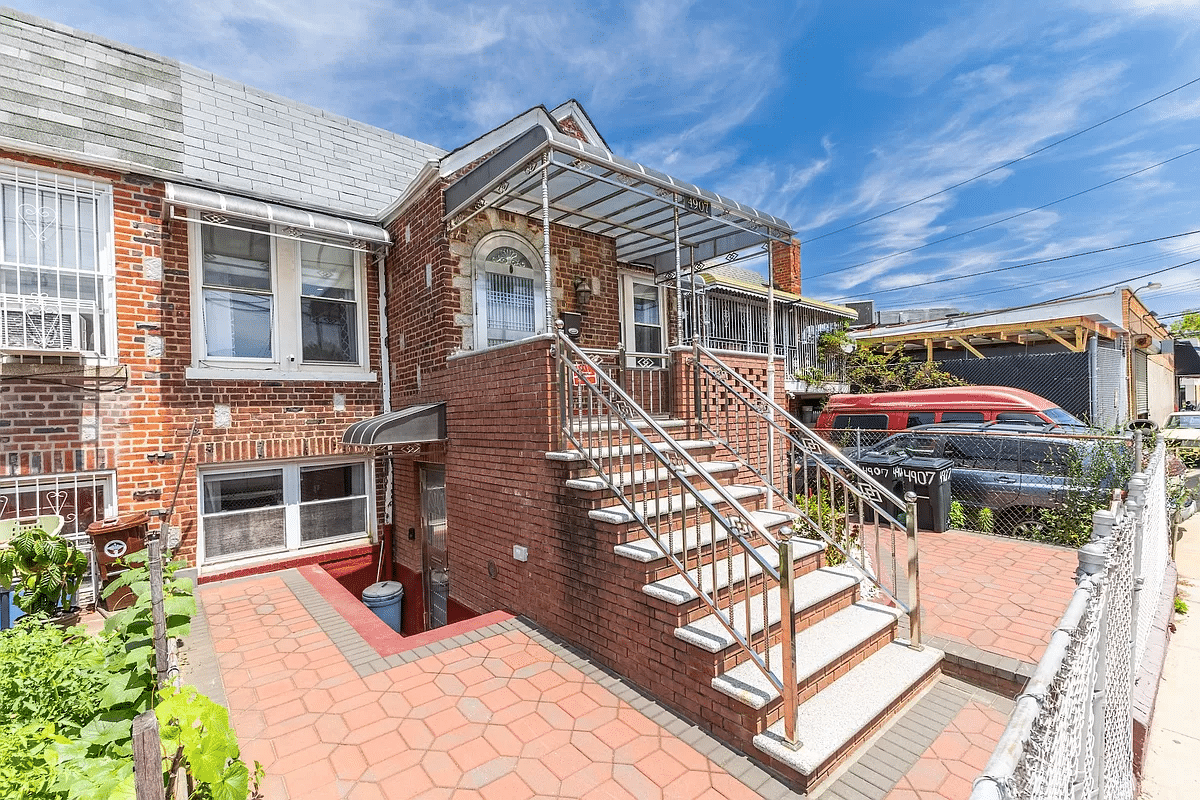 brick house with stoop and basement entry