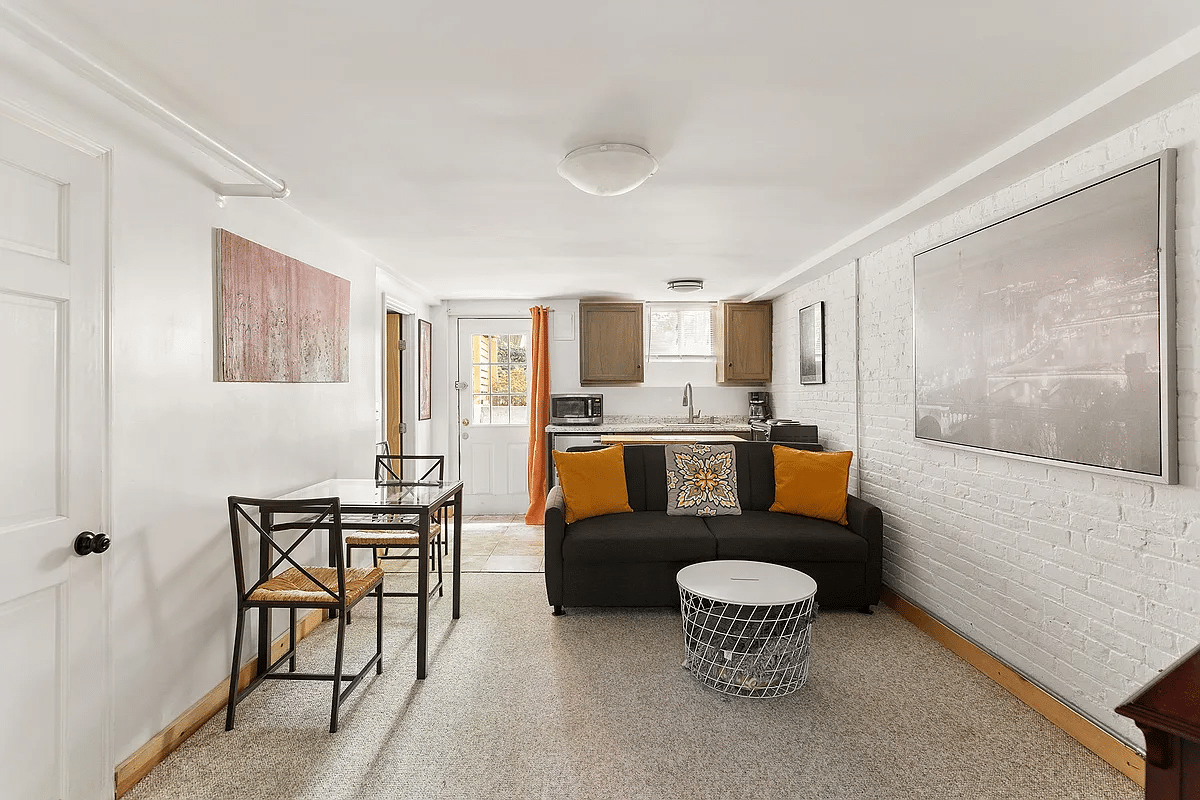 basement living room with kitchenette