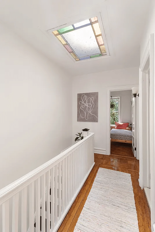 upstairs hall with stained glass skylight