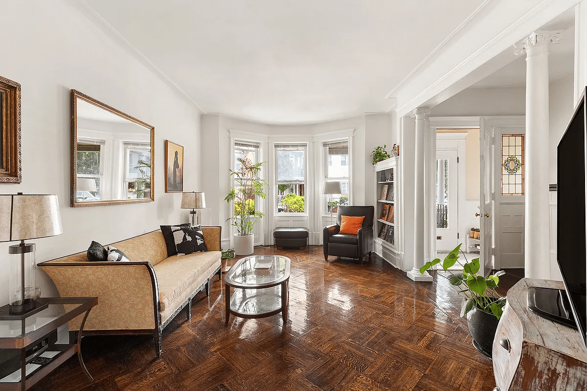 flatbush - front parlor with bay window, columns, wood floor