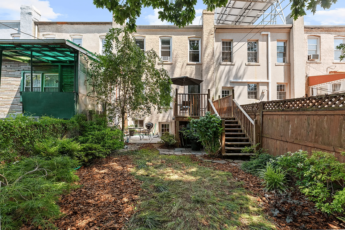 View of the backyard with patio, paved terrace and lawn