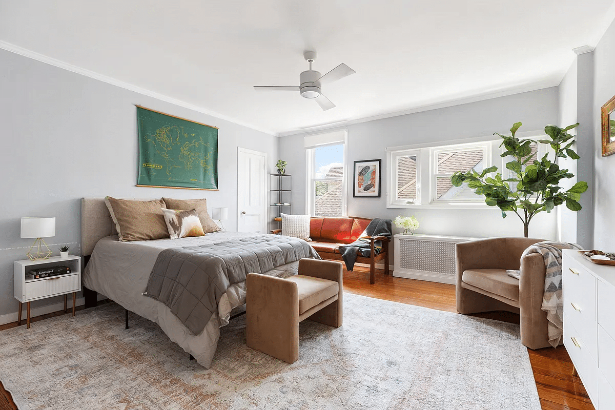 Bedroom with wooden floor, ceiling fan