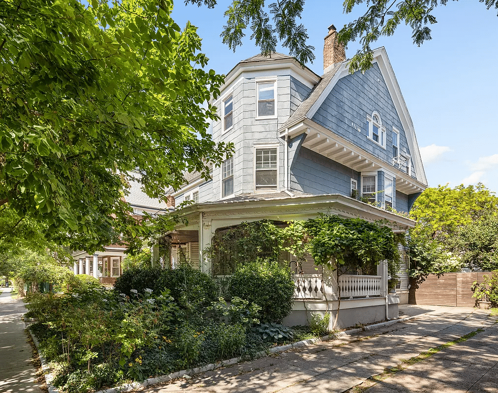 Exterior view with hipped roof, wraparound veranda