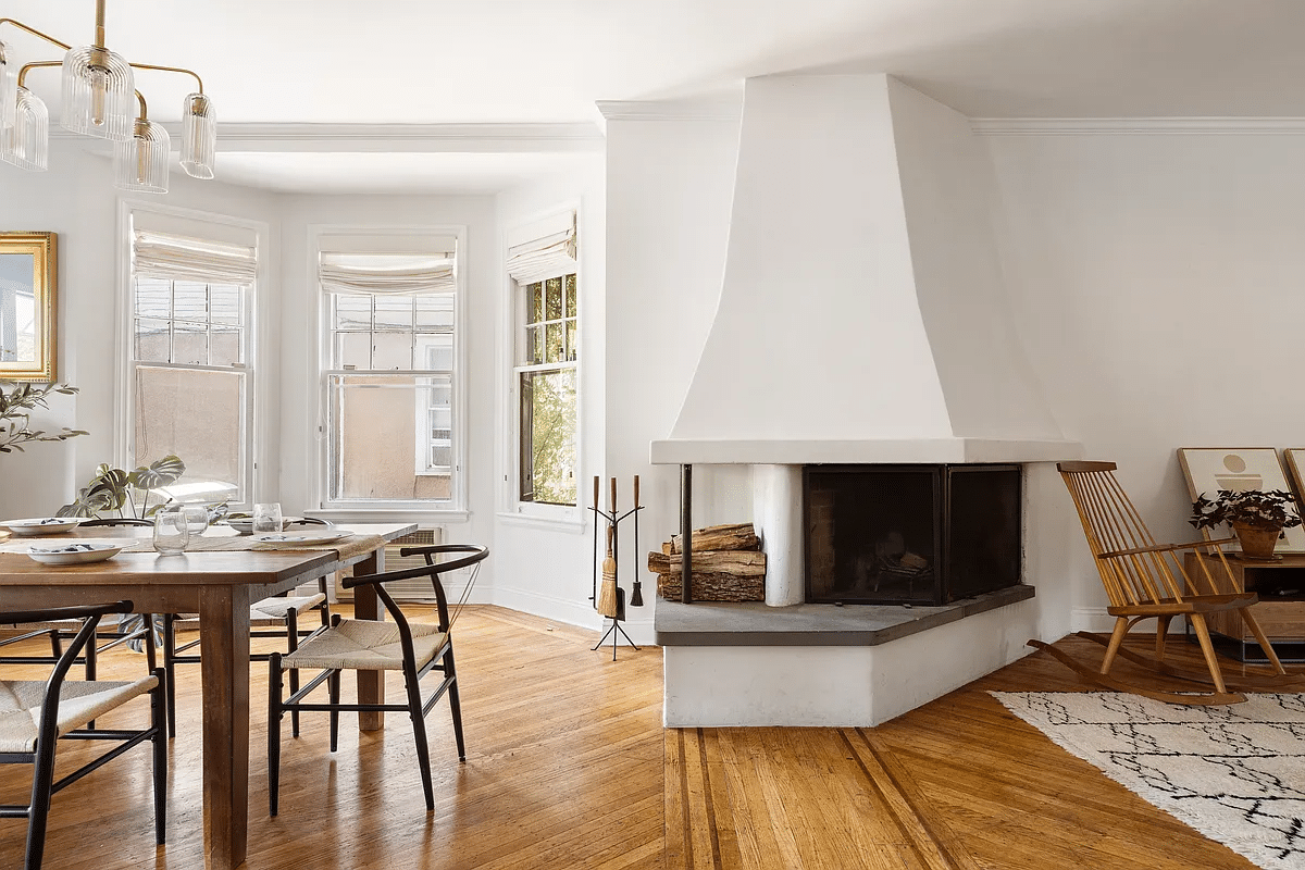 open living and dining room with modern fireplace