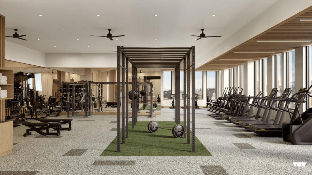 gym with full height windows