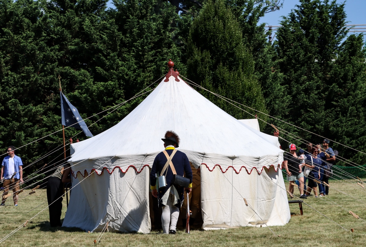 battle of brooklyn - a reenactor enters a tent