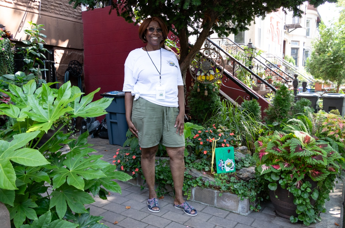 woman posing in her front garden