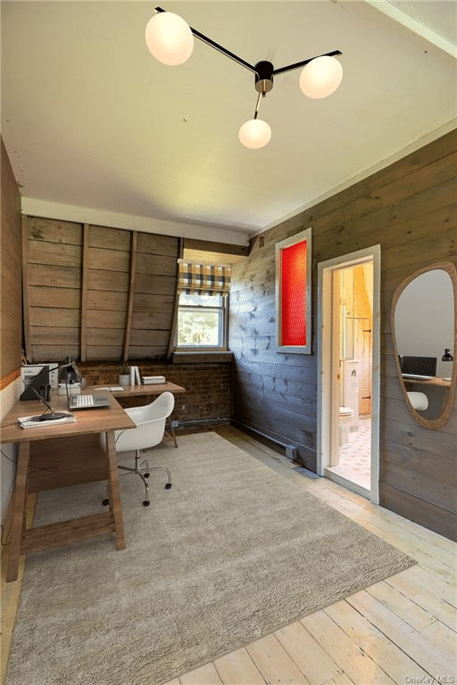 attic workspace with paneling