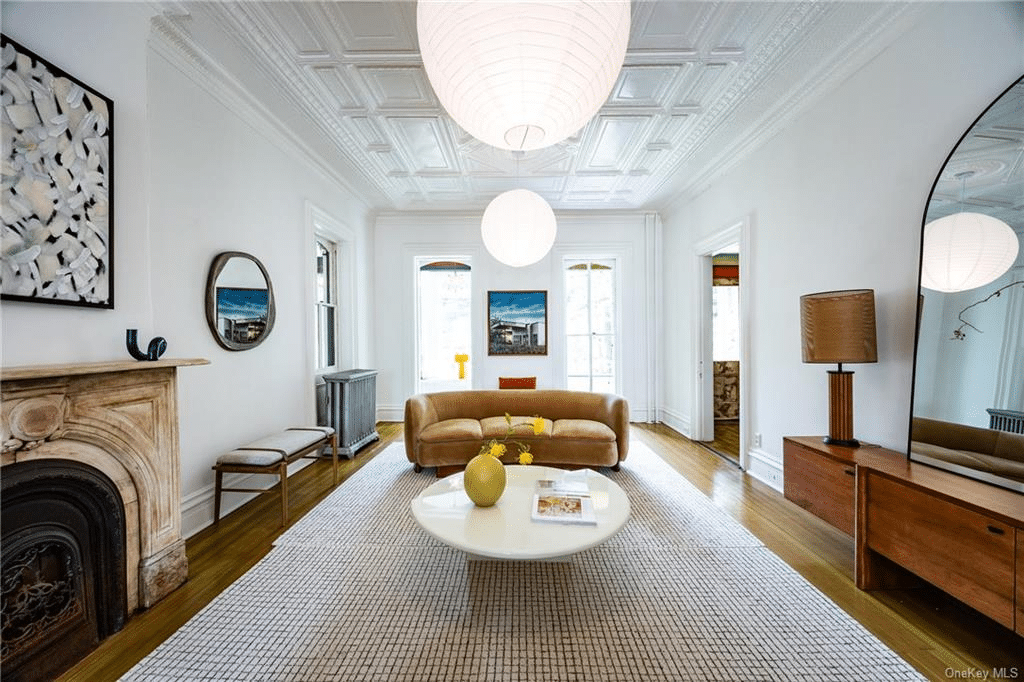 parlro with marble mantel, high ceiling