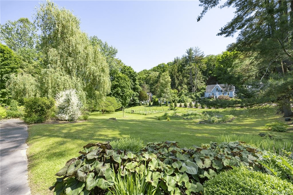 view of lawn and neighboring house across the street