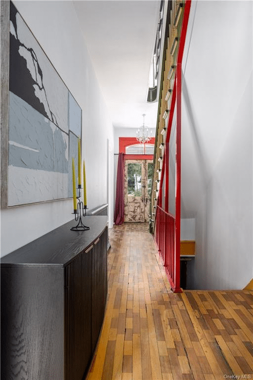 hall with wood floor stained in patterns