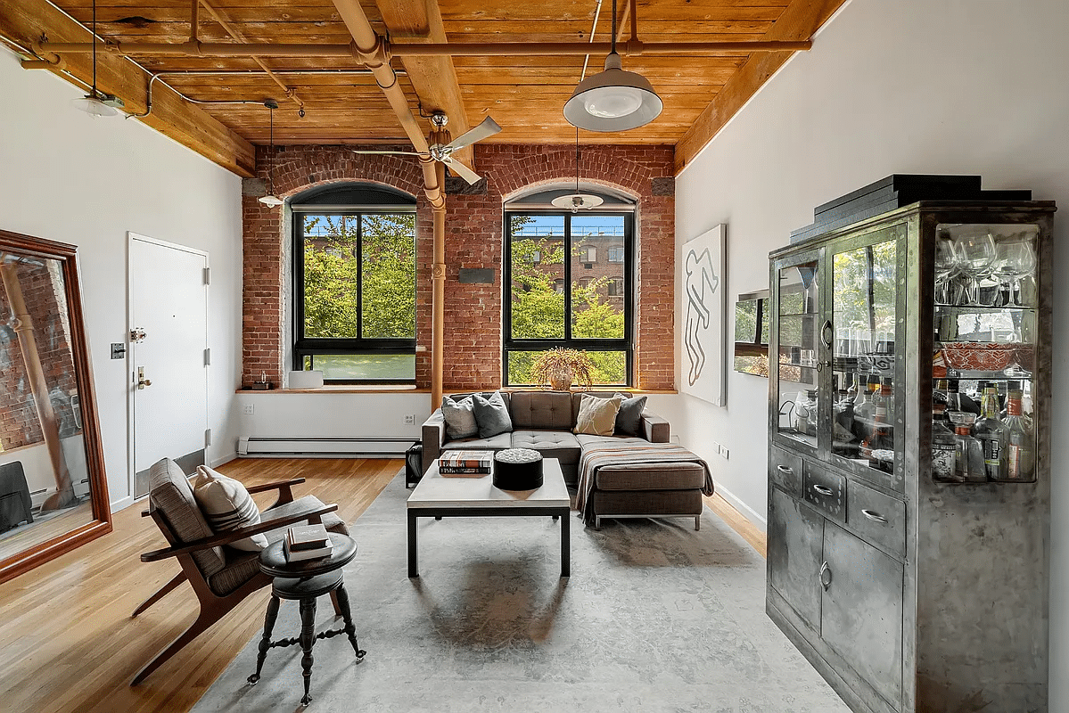 park slope - living room with exposed beams, brick and pipes