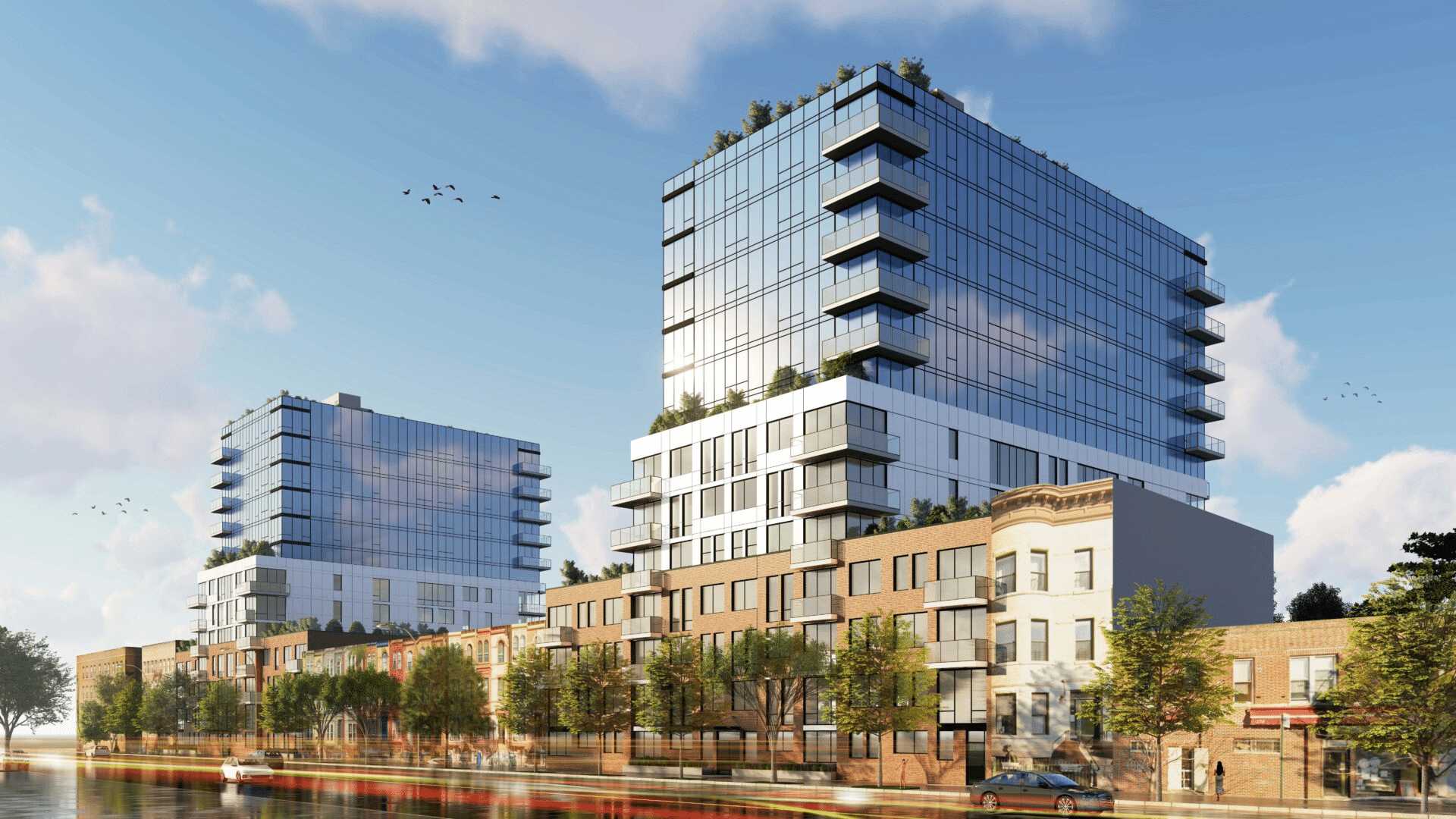 rendering showing buildings with brick bases and glass tower