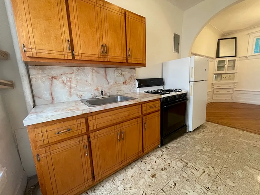 kitchen with wood cabinets, formica counter