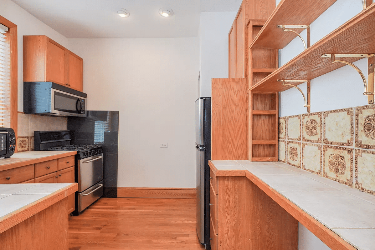 kitchen with wood cabinets, open shelves