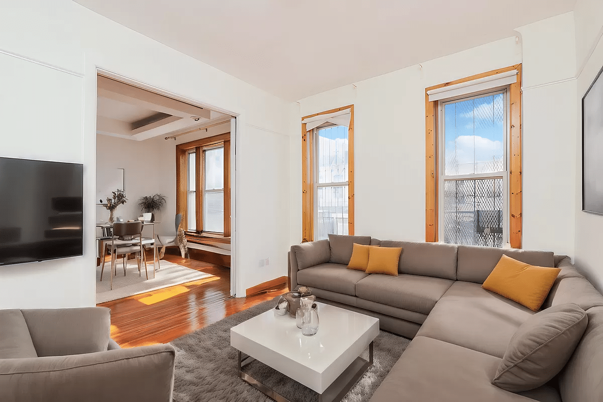 virtually staged living room with view into dining room