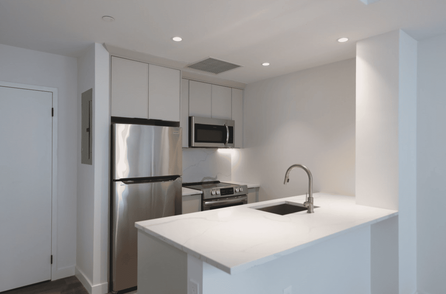 kitchen with white cabinets and counter