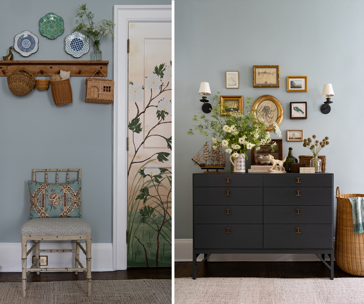 a small chair against a blue wall and a dresser with artwork above