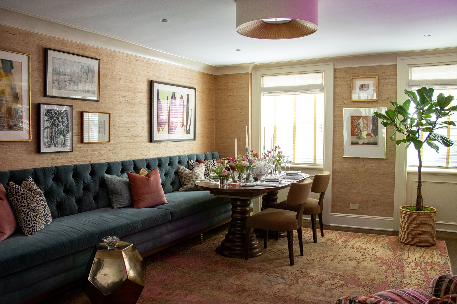 dining room with grass cloth walls and a blue banquet