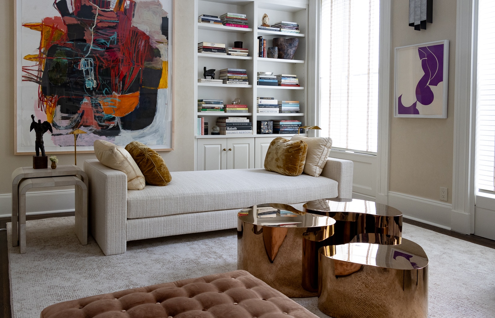 parlor with white carpet and sofa and metallic tables