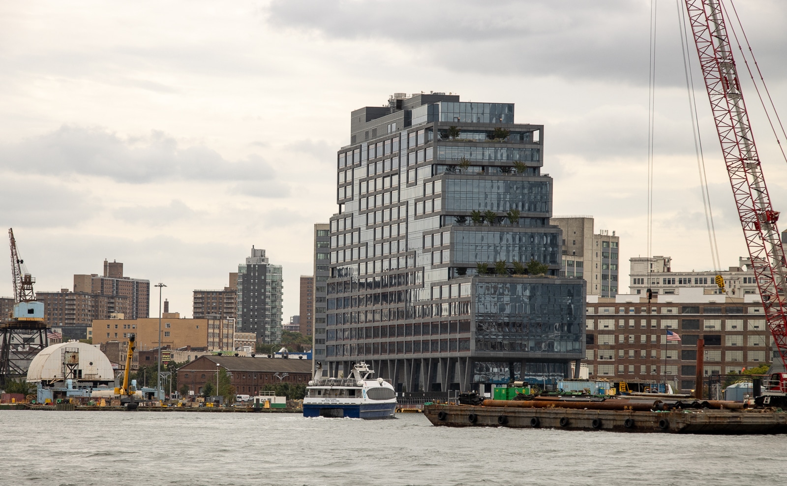 Brooklyn - the waterfront of the Brooklyn Navy Yard with a ferry pulling in