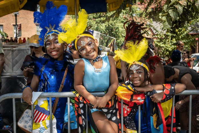 costumed revelers watching the parade