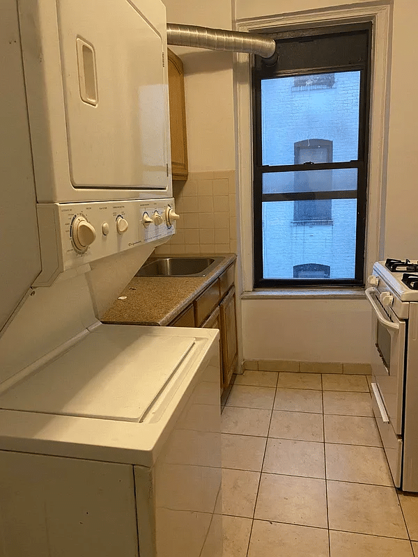 kitchen with tile floor and a washer/dryer