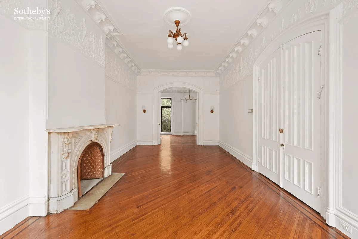 clinton hill parlor with plasterwork and a marble mantel