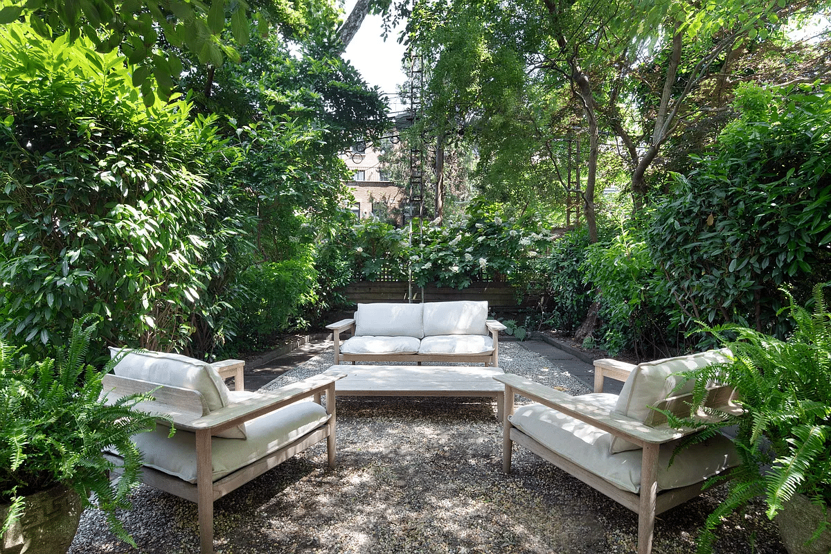 rear yard with gravel covered seating area