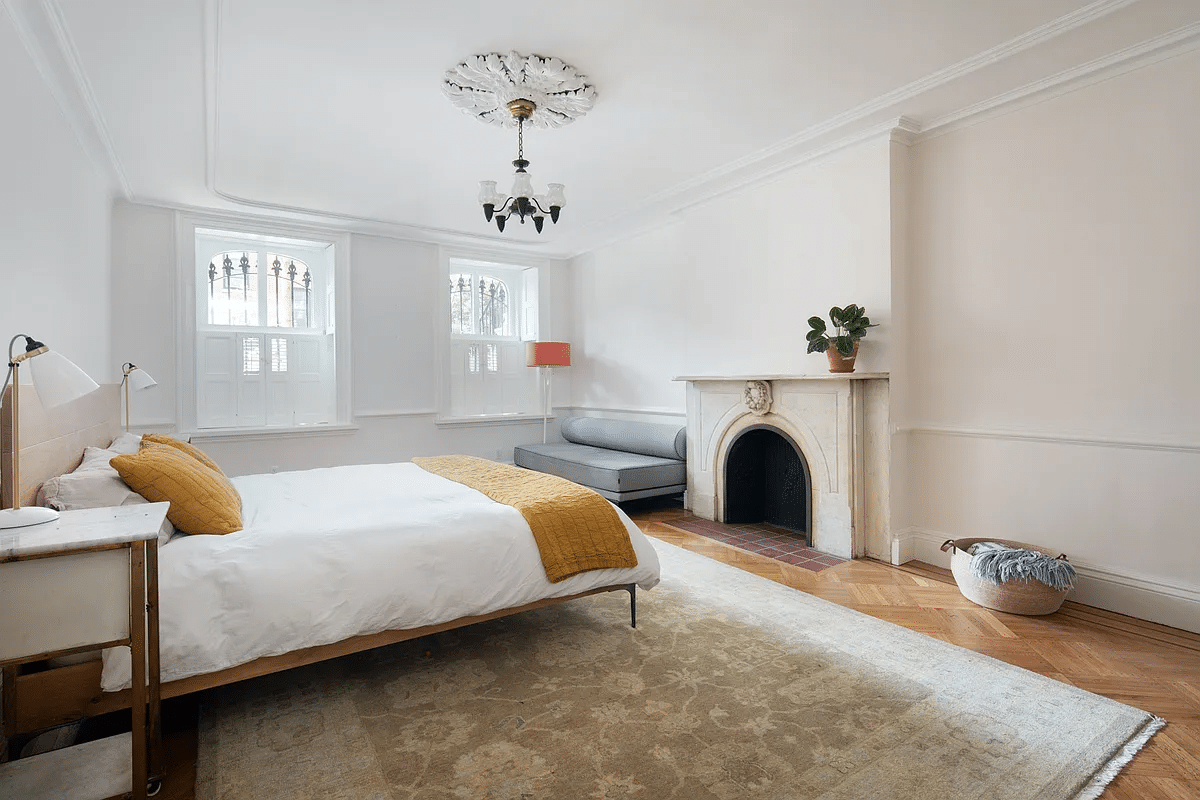 garden level bedroom with marble mantel, ceiling medallion