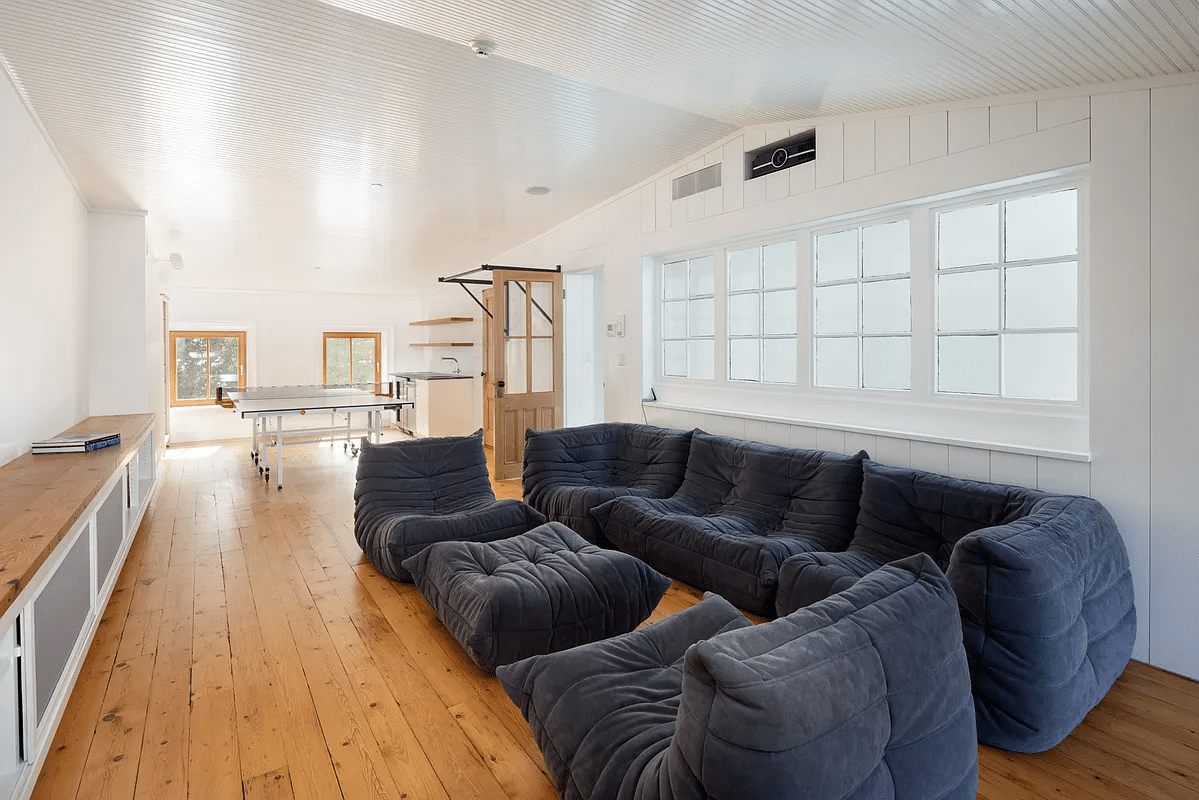 attic with angled ceiling, wood floor