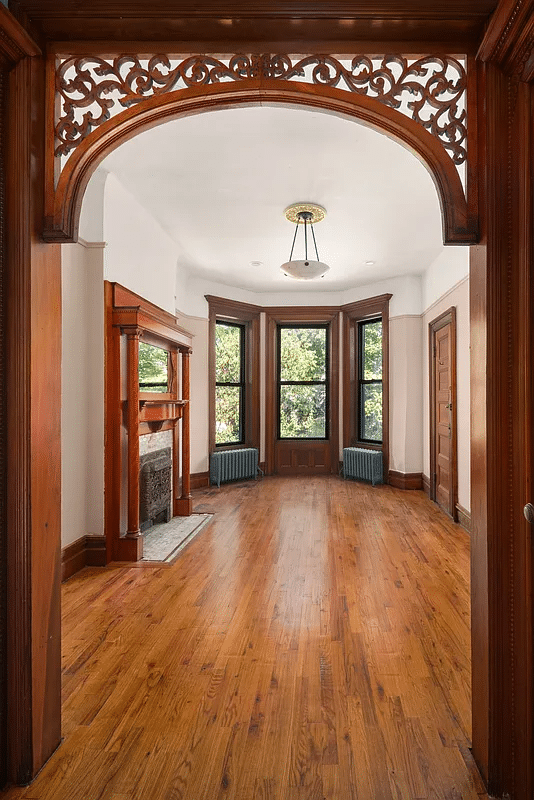 bedroom with fretwork, mantel