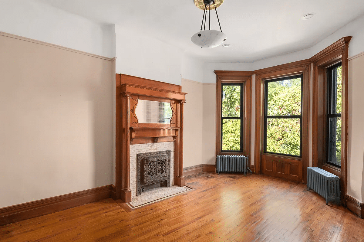 bedroom with mantel with mirror