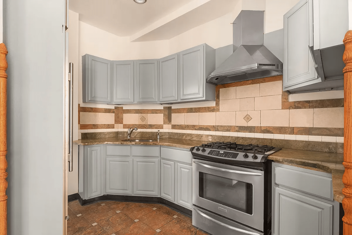 kitchen with gray cabinets, brown tile