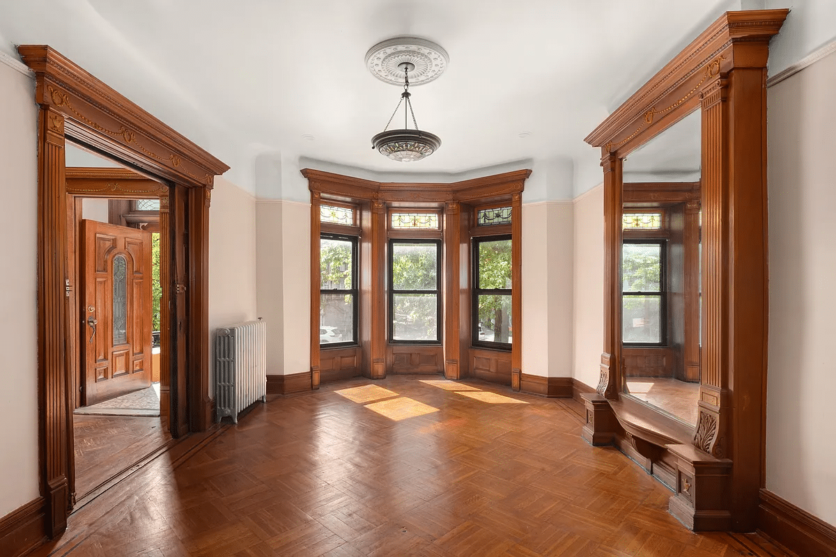 crown heights - parlor with mirror, stained glass, wood floor