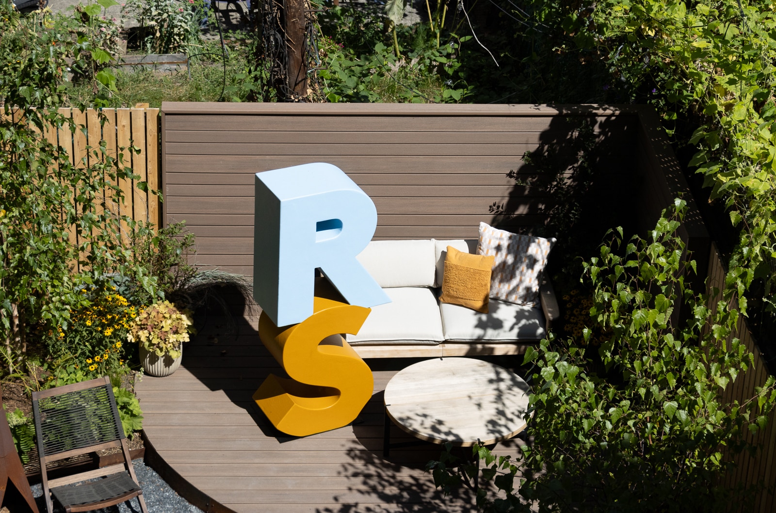 rear yard with a giant R S  for Real Simple