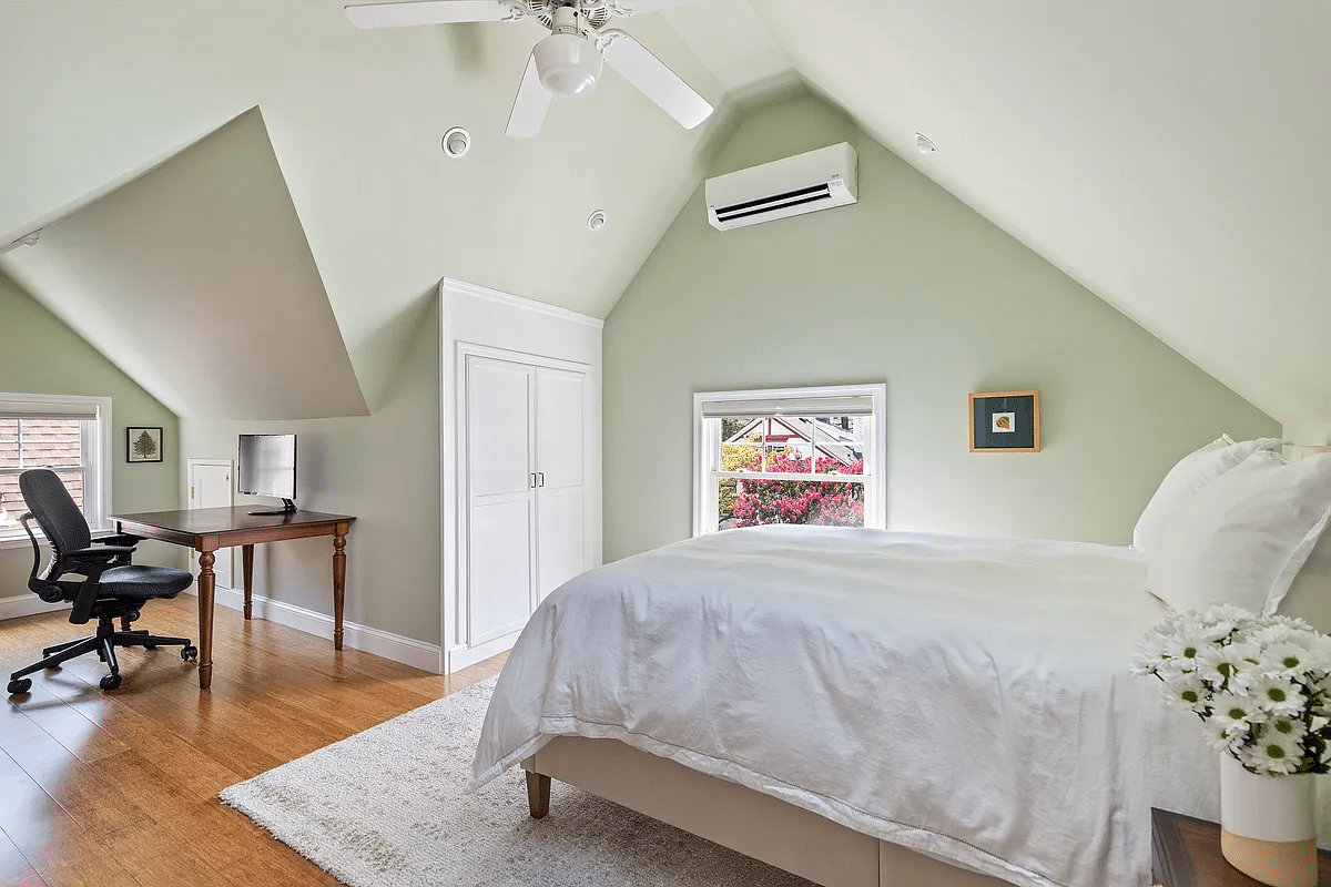 bedroom with sloped ceilings and room for a desk or sitting area