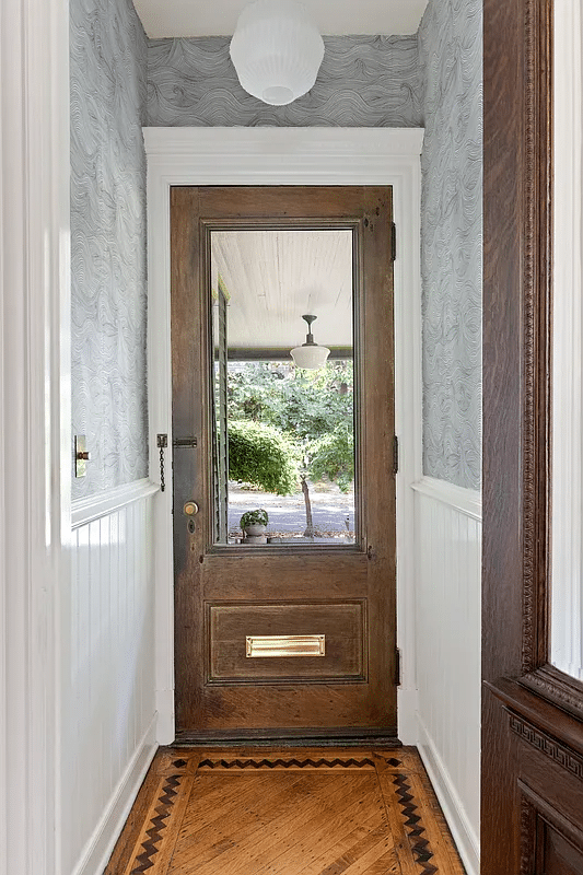 front entry with white painted wainscoting