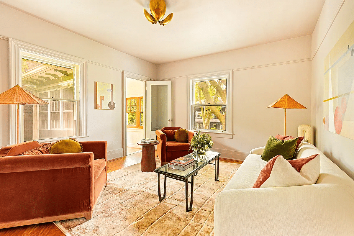 bedroom set up as a sitting room with door to sleeping porch