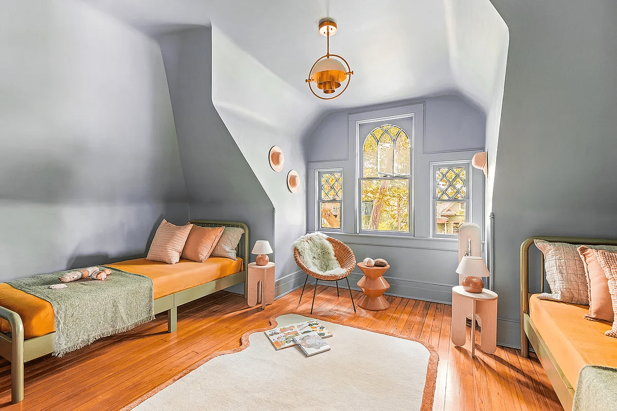 top floor bedroom with wood floor, dormer window